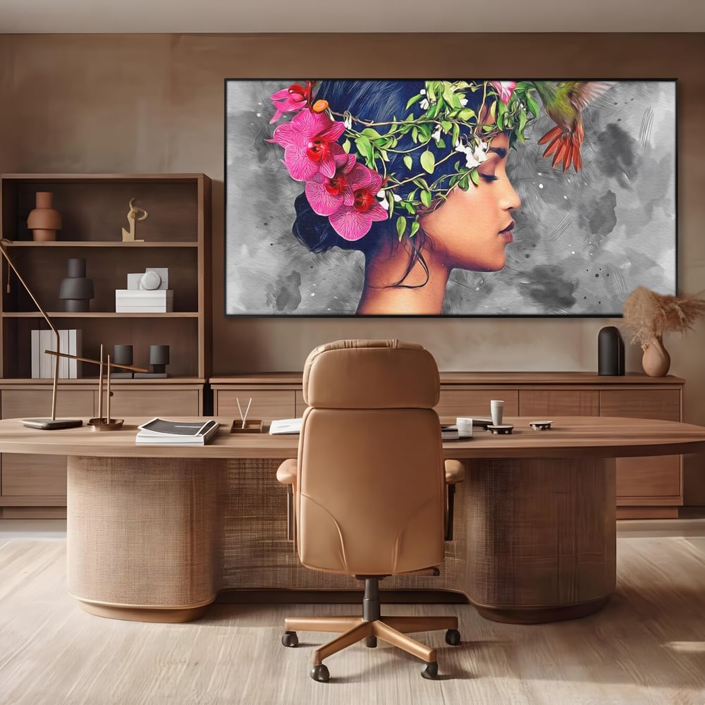 Tablou canvas cu tablou canvas cu portret de femeie si colibri, in rama de aluminiu negru, pe perete intr-un birou
